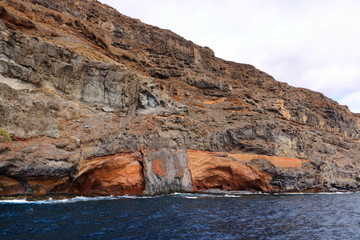 Rocky cliffs on the shore on the coast of La Gomera Island, Canary Islands in Spain