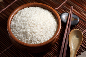 close up Japanese rice in measuring cup on table, Japanese rice in kitchen background