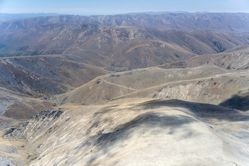 cloud shadow on Hawkdun range barren slopes, near Omarama, New Zealand