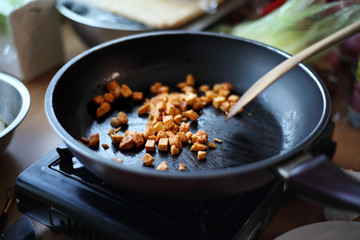 close up cooking spicy Korean chicken in pan