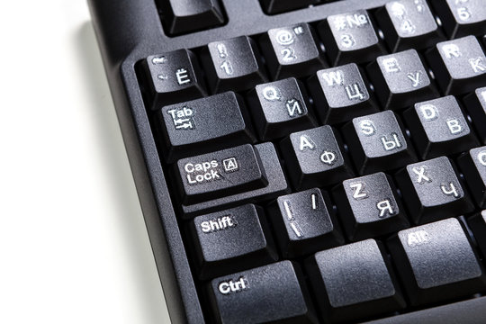 electronic collection - detail black computer keyboard with russian letter with key tab, key caps, key shift on white background