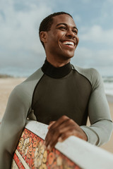Smiling male surfer