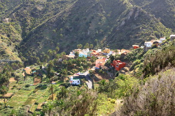 Fototapeta na wymiar Colorful homes in Guaidil near Vallehermoso town and valley on the island of La Gomera, Canary Islands, Spain