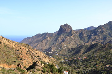 Fototapeta premium Colorful homes in Guaidil near Vallehermoso town and valley on the island of La Gomera, Canary Islands, Spain
