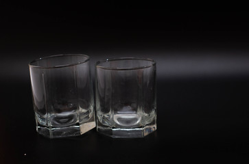 clear glasses for water on a black background