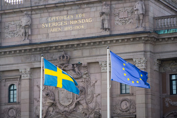The Swedish flag and the flag of the European Union in front of the Swedish Parliament in Stockholm. 