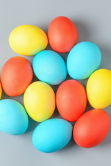 Fototapeta na wymiar Colorful Easter eggs on a gray background. Easter eggs background. Easter eggs are a symbol and a mandatory attribute of the holiday.