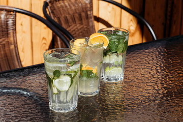 Citrus mojito made from lime and orange. Fresh summer drinks with ice.