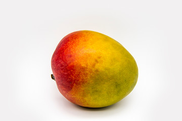 Mango fruit isolated on white background. One ripe mango fruit isolated. Healthy one whole fresh big ripe red mango fruit for the diet meal