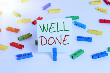 Text sign showing Well Done. Business photo showcasing telling demonstrating that he made his task or job in perfect shape Colored clothespin papers empty reminder white floor background office