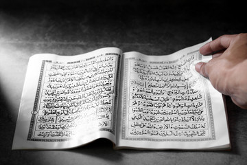 Islamic Book Koran on a concrete background, Islamic background in ramadan