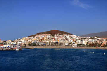 Fototapeta na wymiar January 31 2020 - Harbor in Los Cristianos, Tenerife, Canary Islands in Spain: Port from the Sea