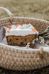 cut cake in a basket with a willow on the grass