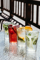 Bright autumn cocktails of lemonade with zirus fruits.
