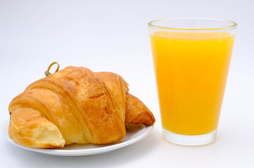 Breakfast served with croissants and orange juice. Balanced diet.
