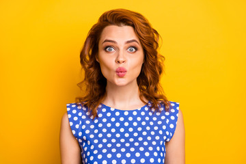 Fototapeta premium Close-up portrait of her she nice attractive lovely lovable winsome girlish affectionate cheerful wavy-haired girl sending air kiss isolated over bright vivid shine vibrant yellow color background