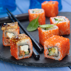 sushi rolls on black