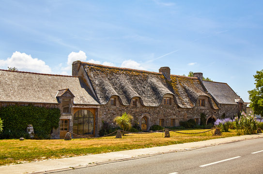 Тraditional stone houses with thatched roof in Brittany