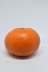 Orange tangerine with peel photographed on a white background,fruits and vitamin c