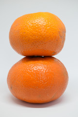 Orange tangerine with peel photographed on a white background,fruits and vitamin c