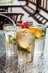 Different types of lemonades with strawberries, citrus, mint. Menu cafe and restaurant. Cold summer drinks.