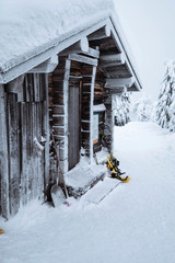 Wooden cabin in a snowy forest in Finland