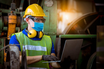 Portrait worker under inspection and checking production process on factory station by wearing...