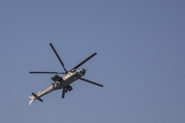 Fototapeta na wymiar Aerobatics on a Mi-35 Hind helicopter