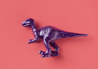 Aerial view of dinosaur toy with colorful background