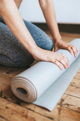 Rolling out a yoga mat