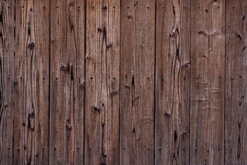 Dark wooden texture. Diagonal background brown wood planks.