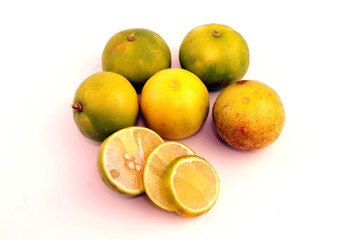 Green lemon fruit on white background