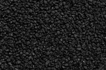 Fototapeta premium Natural fire ashes with dark grey black coals texture. It is a flammable black hard rock. Space for text. 