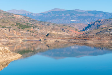 blue waters of the Beninar reservoir (Spain)