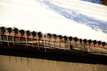 icicles and snow on roof