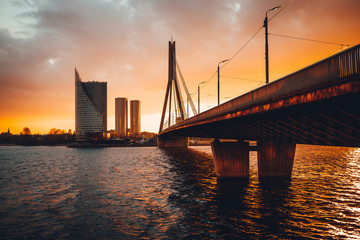 Vansu bridge in Riga cable-stayed bridge  crosses the Daugava river in susnet time