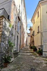 Obraz na płótnie Canvas A narrow street between the old houses of a medieval village