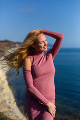 blonde model on the beach at the summer 