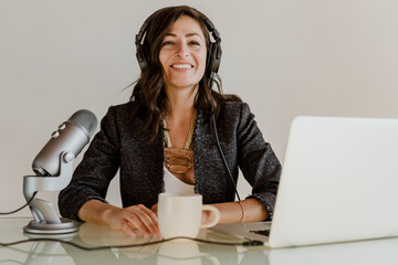 Woman recording her own podcast