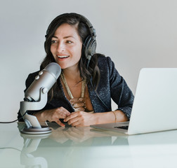 Woman recording her own podcast