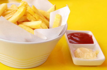 French fries with ketchup and mayonnaise, Close up front view of potato fry.