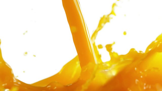Super slow motion of pouring orange juice isolated on white background. Filmed on high speed cinema camera, 1000 fps.