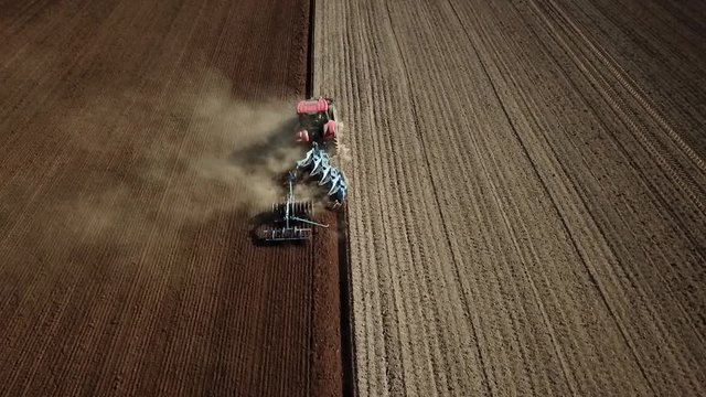 tractor with plough - drone footage
