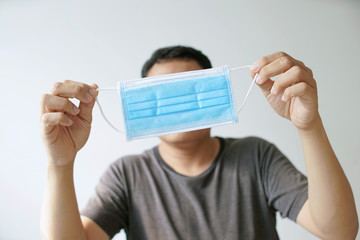 Man hold face mask, Wear a face mask is the basis of helping prevent viruses, flu and diseases,...
