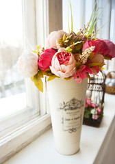 Beautiful bouquet of  pink peonies on the window.