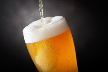 beer pouring into glass