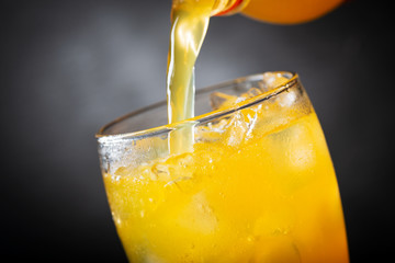 soft drink, pouring orange soda into glass