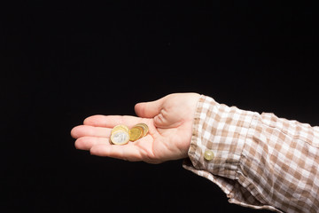 Coins in a person's hand