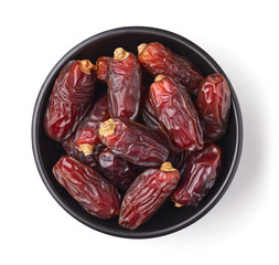 Bowl of dates isolated on white, from above