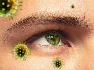 Close up shoot of a male eye with 3D-illustrated coronavirus models, the way of infecting. Concept...